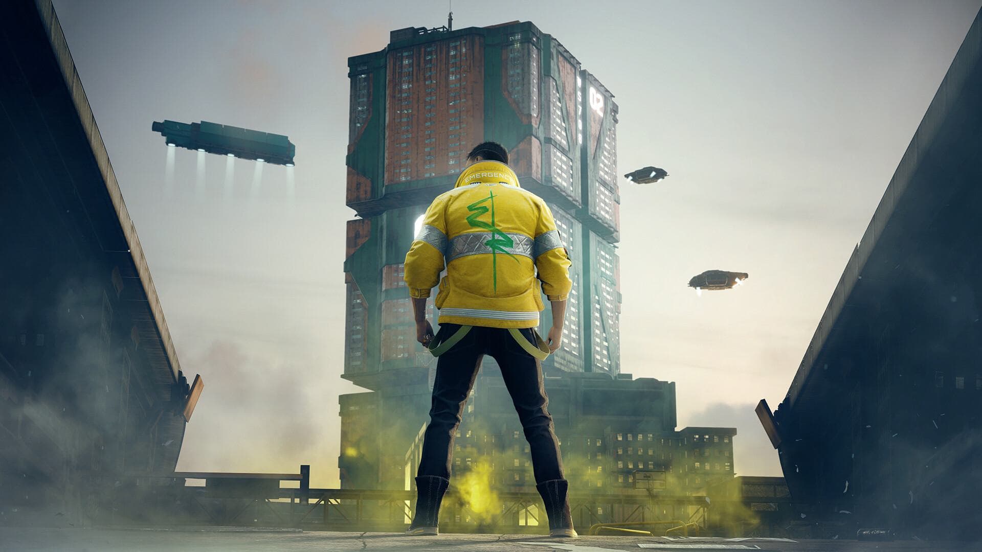 A Cyberpunk 2077 hero looks up at a Night City tower